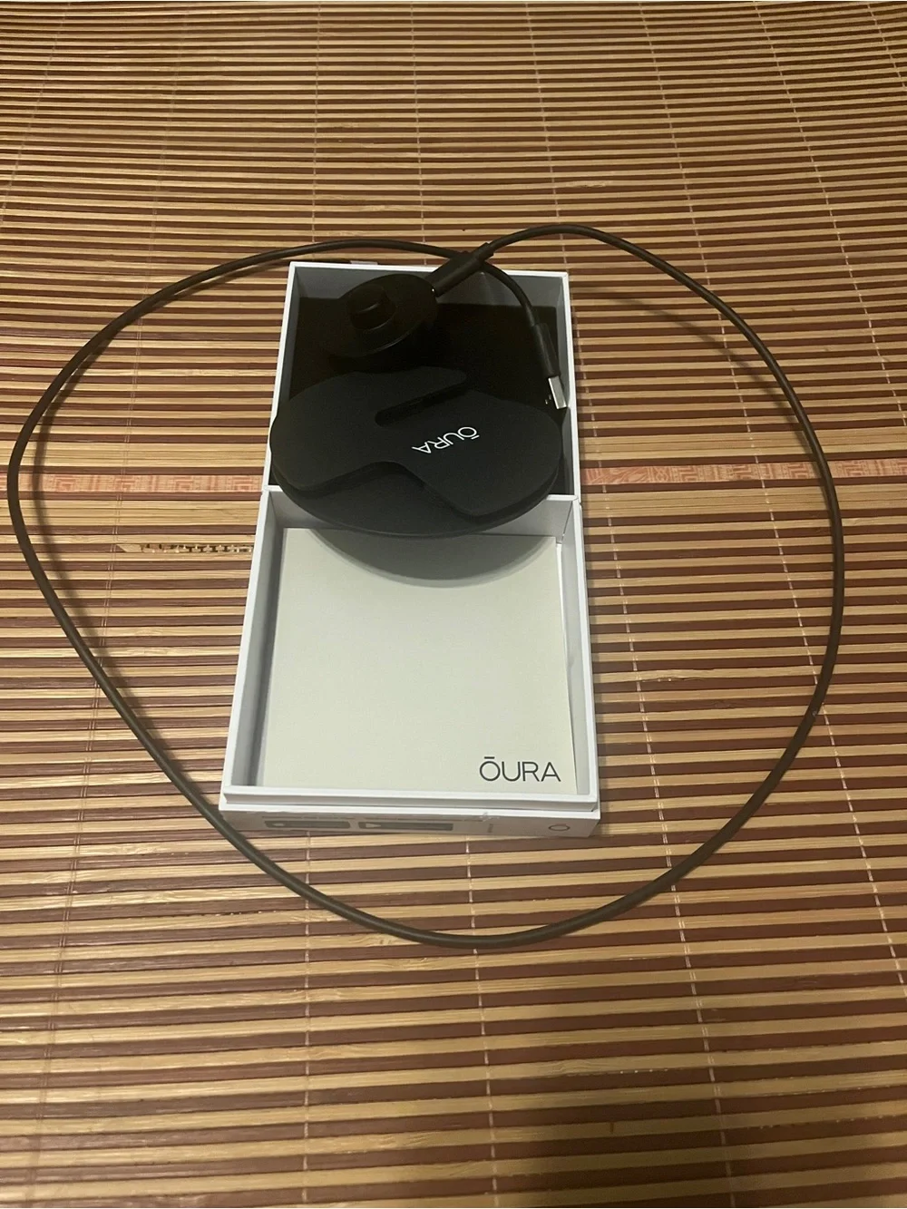 Oura Black Sensor Ring Charging Dock